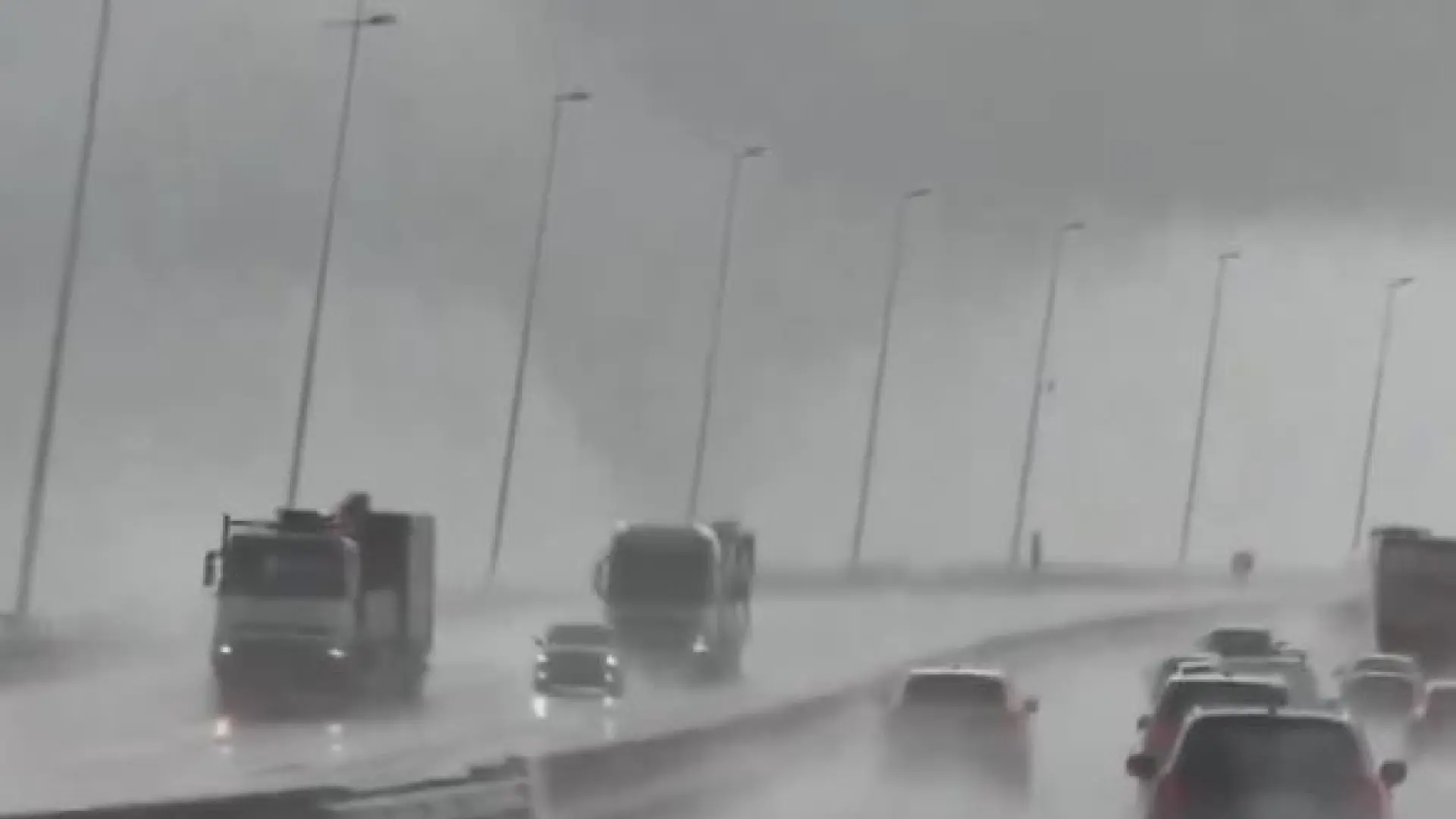 An impressive tornado surprises drivers crossing a bridge in Lisbon