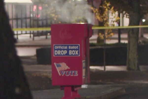 Several ballot boxes with hundreds of early voting ballots are burned in two US states